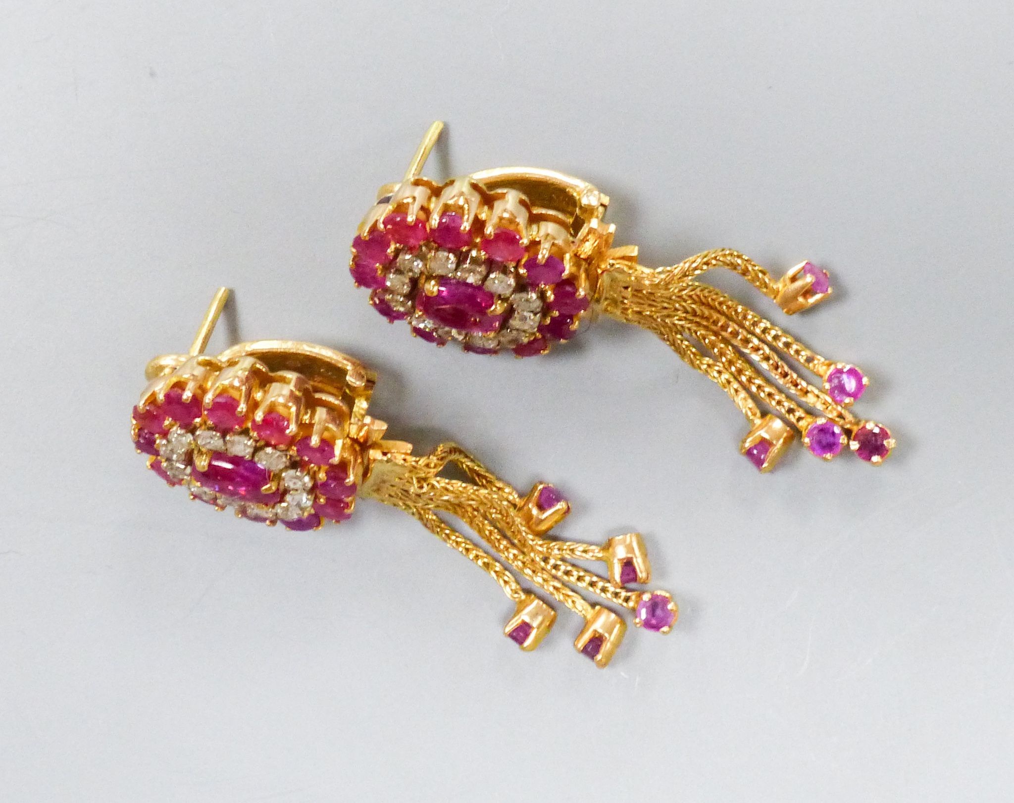 A pair of Indian yellow metal, ruby and diamond cluster earrings with detachable tassel drops, 43mm, gross weight 15.6 grams.